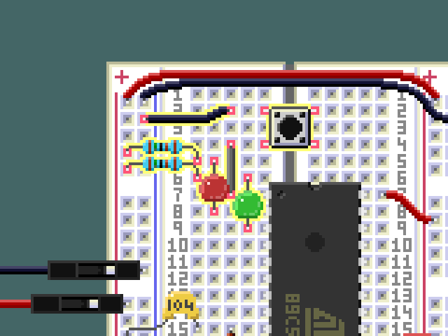 Detail view of the LEDs and button on the breadboard.